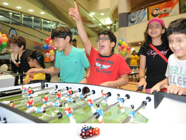 Children playing foosball